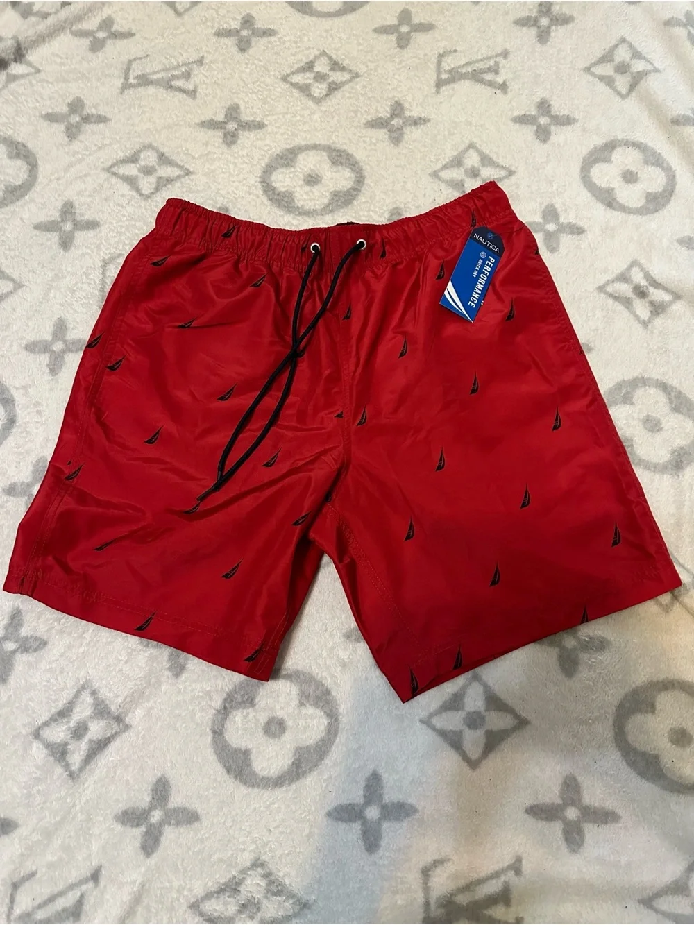 Nautica Red Swim Trunks with Small Black Sailboat Motif